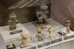 　岩手県立博物館の常設展示に並ぶ岩手県で出土した遮光器土偶＝盛岡市