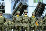　陸上自衛隊の第８地対艦ミサイル連隊編成完結式で整列する隊員＝３０日午後、大分県由布市の陸自湯布院駐屯地
