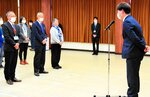 被災地での活動を報告する尾坂主事（右）