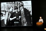 高木東六氏の足跡を写真とともに解説する藤井教授＝１日、米子市公会堂