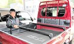 トラレールを開発した岩出代表＝豊岡市但東町出合の但東自動車