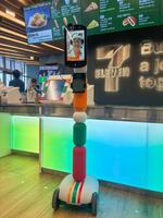 　大阪・関西万博会場内のコンビニ「セブン―イレブン」に導入される、遠隔接客用アバターロボット＝２日午後、大阪市此花区