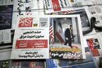 　イラン核開発問題を巡る米国とイランの協議を伝える新聞＝１２日、イラン・テヘラン（ゲッティ＝共同）