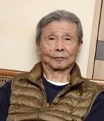 　梁石日
