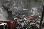 　２４日、ウクライナの首都キーウで、ロシア軍によるミサイル攻撃で破壊された建物（共同）