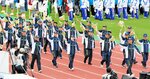 力強い足取りで入場行進する鳥取県選手団＝７日、鹿児島市の白波スタジアム
