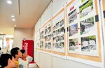 昨年の台風７号で被災した美方郡内の復旧状況をパネルで見る来場者＝新温泉町浜坂の浜坂多目的集会施設