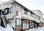 町の計画では、空き店舗の「かなお商店」は今後解体され、跡地に新施設が建設される＝１５日、大山町大山