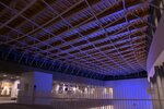青色にライトアップされたエントランス天井＝２３日、境港市上道町の市民交流センター